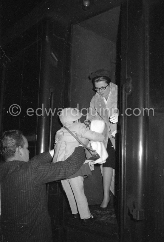 Princess Grace and Caroline leaving by train for Switzerland, seen off by Rainier. Monaco Station 1959. (Grace Kelly) - Photo by Edward Quinn