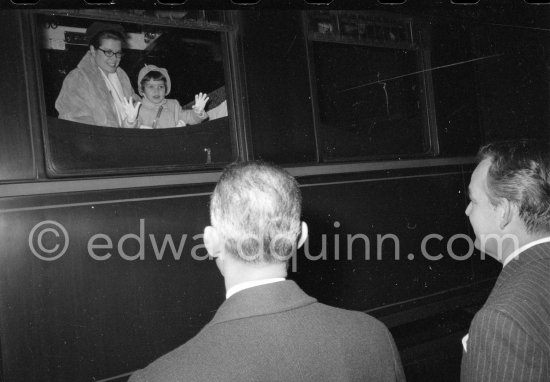 Princess Grace and Caroline leaving by train for Switzerland, seen off by Rainier. Monaco Station 1959. (Grace Kelly) - Photo by Edward Quinn