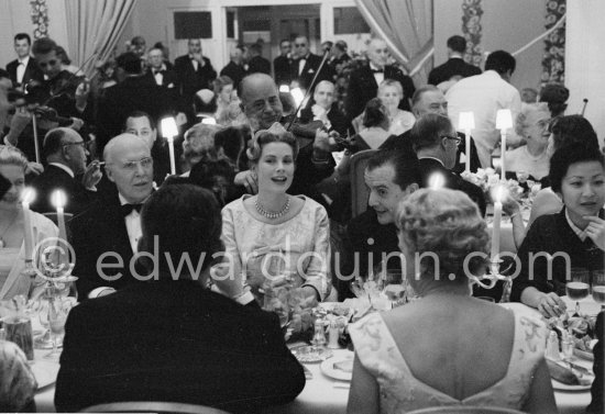 Princess Grace (on the left with glasses), her last outing before her second maternity, on left Prince Pierre, on right her doctor Dr. Donat. Bal de la Rose gala dinner at the International Sporting Club in Monte Carlo, 1958. (Grace Kelly) - Photo by Edward Quinn