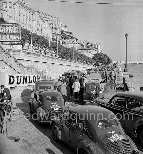 Arrival of participants, entrance to the parc fermée. N° 296 Mme Itier / Rispal on Renault 4CV; N° 292 Vernet /Perrard on Renault 4CV; N° 321 Rosier /Rosier on Renault 4CV. Rallye Monte Carlo 1951. - Photo by Edward Quinn