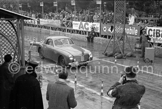 N° 103 Mmes Simon / Gordine on Simca 8 S undergoing the breaking and starting test. Cars will have to accelerate as fast as possible for 200 metres from a standing start, and then pull up in the shortest possible distance, for the cars have to keep a line between the axles. Rallye Monte Carlo 1951. - Photo by Edward Quinn