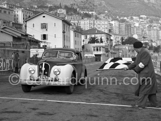 N° 24 Cohade / Monjo on Hotchkiss. Rallye Monte Carlo 1953. To prevent the competitors from taking the timekeepers by surprise and passing without being spotted the organisers decided to paint the front wings of the cars white with washable paint. This enabled the officials to identify them a long way off even if their rally plates were not easily visible because of dirt or their position on the car. (Louche p. 118) - Photo by Edward Quinn