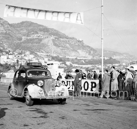 N° 159 White / Wakelin on Ford Pilot. Rallye Monte Carlo 1953. To prevent the competitors from taking the timekeepers by surprise and passing without being spotted the organisers decided to paint the front wings of the cars white with washable paint. This enabled the officials to identify them a long way off even if their rally plates were not easily visible because of dirt or their position on the car. (Louche p. 118) - Photo by Edward Quinn