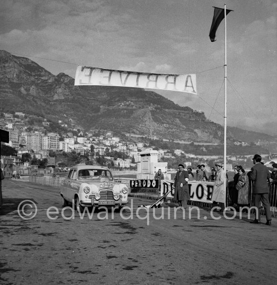 N° 365 M. Gatsonides and P. Worledge on Ford Zephyr on arrival at Monte Carlo beach after Col de Braus regularity test. Monte Carlo Rally 1953. To prevent the competitors from taking the timekeepers by surprise and passing without being spotted the organisers decided to paint the front wings of the cars white with washable paint. This enabled the officials to identify them a long way off even if their rally plates were not easily visible because of dirt or their position on the car. - Photo by Edward Quinn