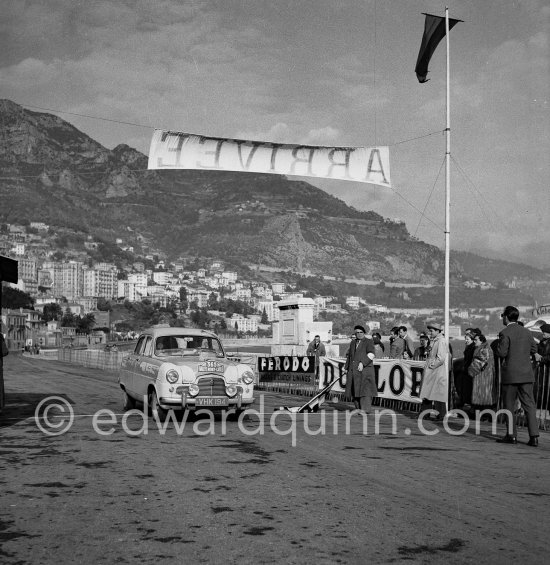 N° 365 M. Gatsonides and P. Worledge on Ford Zephyr on arrival at Monte Carlo beach after Col de Braus regularity test. Monte Carlo Rally 1953. To prevent the competitors from taking the timekeepers by surprise and passing without being spotted the organisers decided to paint the front wings of the cars white with washable paint. This enabled the officials to identify them a long way off even if their rally plates were not easily visible because of dirt or their position on the car. - Photo by Edward Quinn