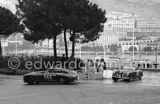N° 365 Mariage / Boris on Aston Martin DB2-4, N° 323 Canonica / Jonneret on Alfa Romeo 1900 Coupé taking part in the regularity speed test on the circuit of the Monaco Grand Prix. Monte Carlo Rally 1955. - Photo by Edward Quinn