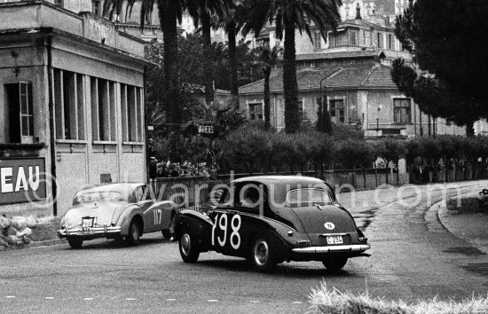N° 117 Merrill / Matthews on Jaguar Mk VII, N° 198 Ingier / Schjolberg on Sunbeam Talbot 90 Mk III taking part in the regularity speed test on the circuit of the Monaco Grand Prix. Rallye Monte Carlo 1955. - Photo by Edward Quinn