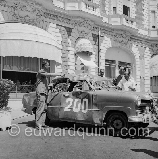 Damaged N° 200, Ford Taunus 12M.16. Rally International des Alpes 1954. In front of Carlton Hotel, Cannes 1954. - Photo by Edward Quinn