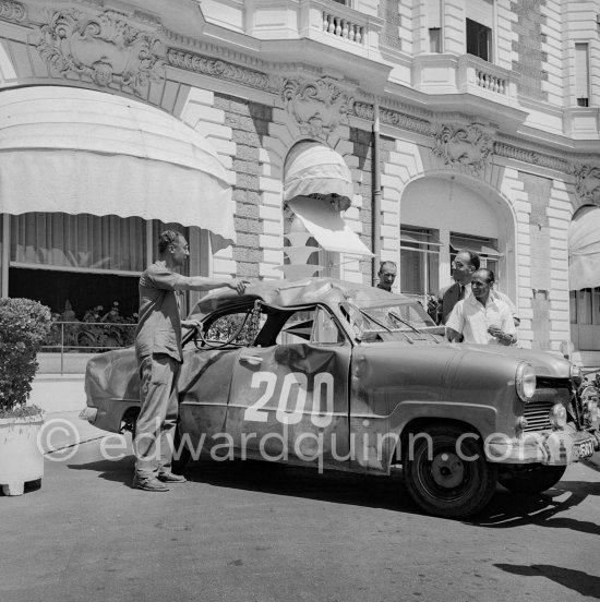 Damaged N° 200, Ford Taunus 12M.16. Rallye International des Alpes 1954. In front of Carlton Hotel, Cannes 1954. - Photo by Edward Quinn