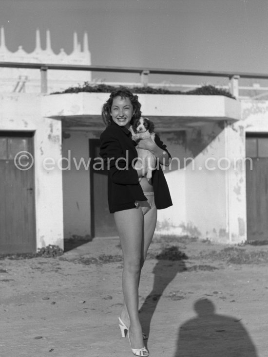 Claude Renault, Miss France 1950, and her shy puppy. Antibes 1951. - Photo by Edward Quinn