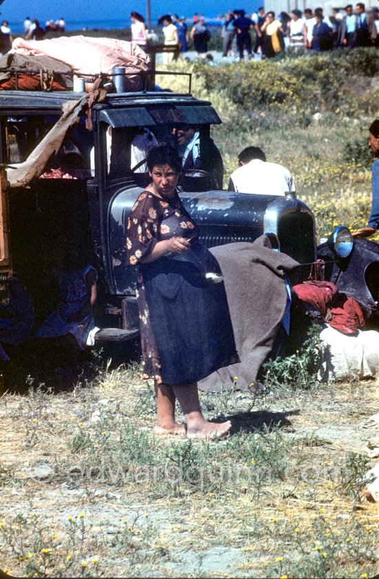 Gypsies on the occasion of the yearly pilgrimage and festival of the Gypsies in honor of Saint Sara, Saintes-Maries-de-la-Mer in 1953. Car not identified - Photo by Edward Quinn