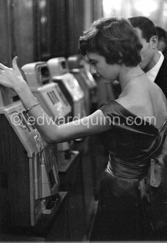 Françoise Sagan at the slot machine, Hotel de Paris, Monte Carlo 1957. - Photo by Edward Quinn