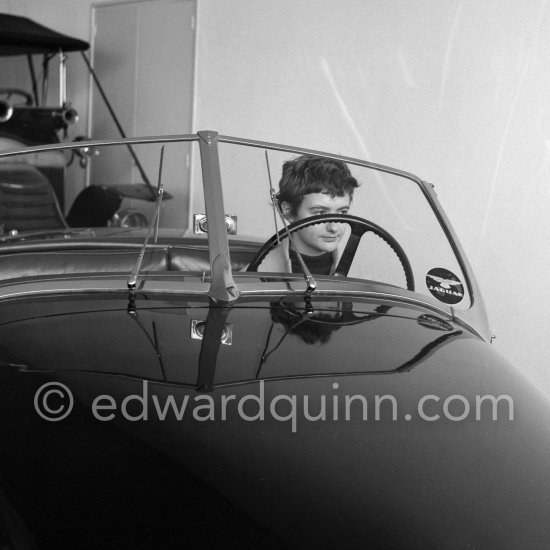 Françoise Sagan evaluating Jaguar XK120 at the showroom of a Jaguar dealer in Cannes 1954. - Photo by Edward Quinn