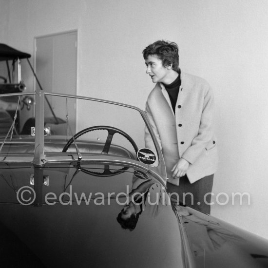 Françoise Sagan a evaluating Jaguar XK120 at the showroom of a Jaguar dealer in Cannes 1954. - Photo by Edward Quinn