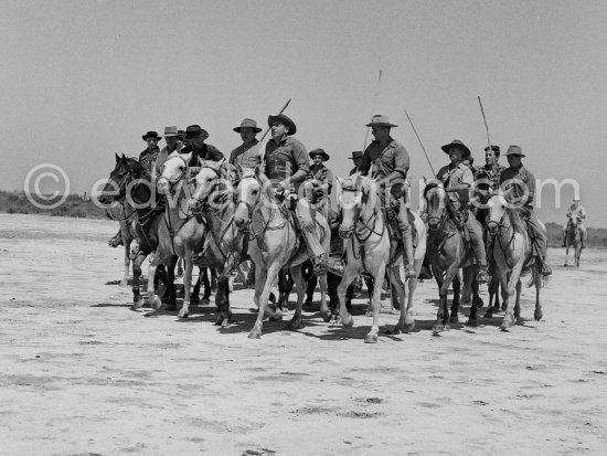 Camargue: Gardians arriving. Saintes-Maries-de-la-Mer in 1953. - Photo by Edward Quinn