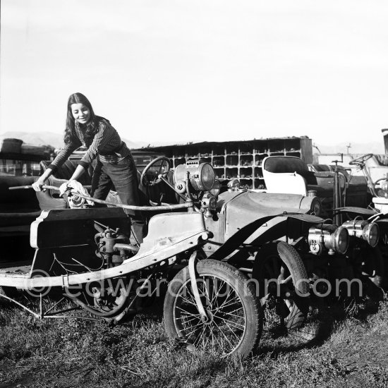 French actress Jacqueline Sassard at an automobile graveyard. Nice 1956. - Photo by Edward Quinn