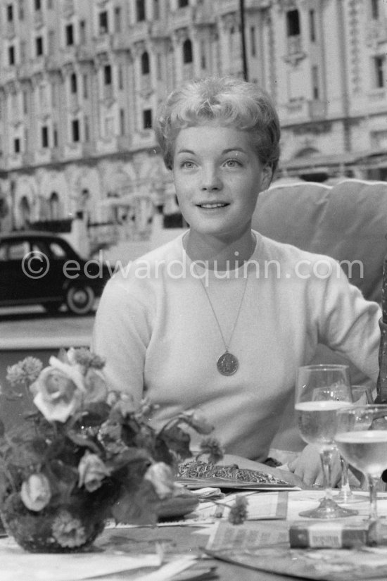 Romy Schneider, with a bunch of the very special crimson roses produced by the leading rose specialist, M. Meilland, christened the "Sissi Cocktail" in her honour. Cannes Film Festival 1957. - Photo by Edward Quinn