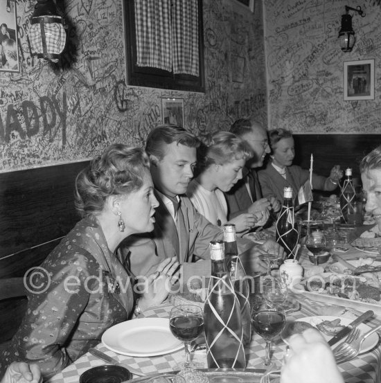 Magda Schneider, Karlheinz Böhm, Romy Schneider at a restaurant in Cannes 1957. - Photo by Edward Quinn