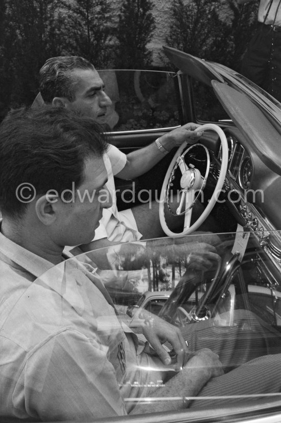 At the wheel Reza Pahlavi, the Shah of Persia. With him his son-in-law Ardeshir Zahedi. Nice Airport 1958. Car: Mercedes-Benz 300 SL - Photo by Edward Quinn