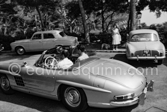 At the wheel Reza Pahlavi, the Shah of Persia. With him his son-in-law Mr. Zahedi. Nice Airport 1958. Car: Mercedes-Benz 300 SL - Photo by Edward Quinn