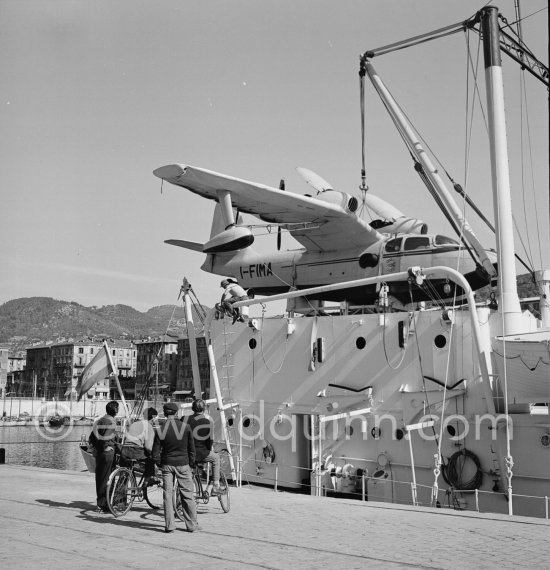 "Olympic Whaler", the whaling ship of Aristotle Onassis. With Italian twin-engine amphibian flying boat I-FIMA, prototype of Piaggio P-136. Nice harbor 1952. - Photo by Edward Quinn