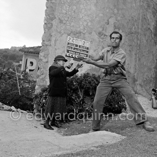 Frank Sinatra on the set of the film "Kings Go Forth" in the village of Tourette-sur-Loup, 1957. Sinatra needed an old lady to partner him in this scene. The villager Marie Isnard, who had never been to the cinema in her life, learned her lines and got through the dialogue very successfully. Sinatra\'s lines were: "Vive General de Gaulle, Vive les Folies-Bergère", about the only French he knew. Tourrettes-sur-Loup 1957. - Photo by Edward Quinn