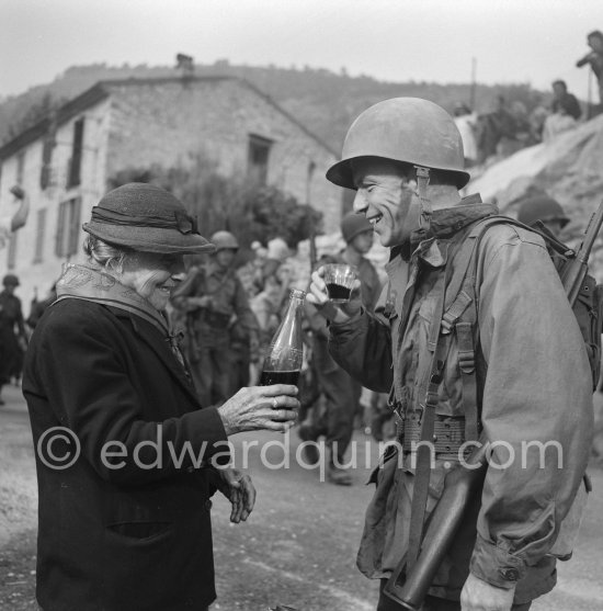 Frank Sinatra on the set of the film "Kings Go Forth" in the village of Tourette-sur-Loup, 1957. Sinatra needed an old lady to partner him in this scene. The villager Marie Isnard, who had never been to the cinema in her life, learned her lines and got through the dialogue very successfully. Sinatra\'s lines were: "Vive General de Gaulle, Vive les Folies-Bergère", about the only French he knew. - Photo by Edward Quinn