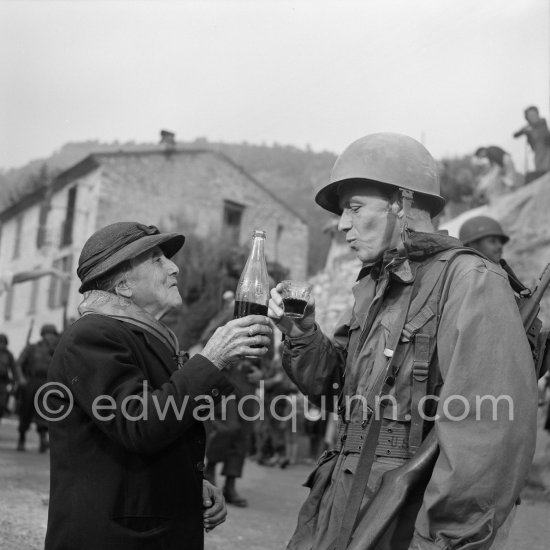 Frank Sinatra on the set of the film Kings Go Forth in the village of Tourette-sur-Loup, 1957. Sinatra needed an old lady to partner him in this scene. The villager Marie Isnard, who had never been to the cinema in her life, learned her lines and got through the dialogue very successfully. Sinatra\'s lines were: \'Vive General de Gaulle, Vive les Folies-Bergere", about the only French he knew. Tourrettes-sur-Loup 1957. - Photo by Edward Quinn