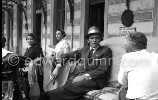 Two curious ladies cannot believe there eyes, it is really "The Voice", the "great Sinatra". They move round to get a better view and look a little bit awed. Monte Carlo Station 1958. - Photo by Edward Quinn