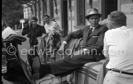 Two curious ladies cannot believe there eyes, it is really "The Voice", the "great Sinatra". They move round to get a better view and look a little bit awed. Monte Carlo Station 1958. - Photo by Edward Quinn