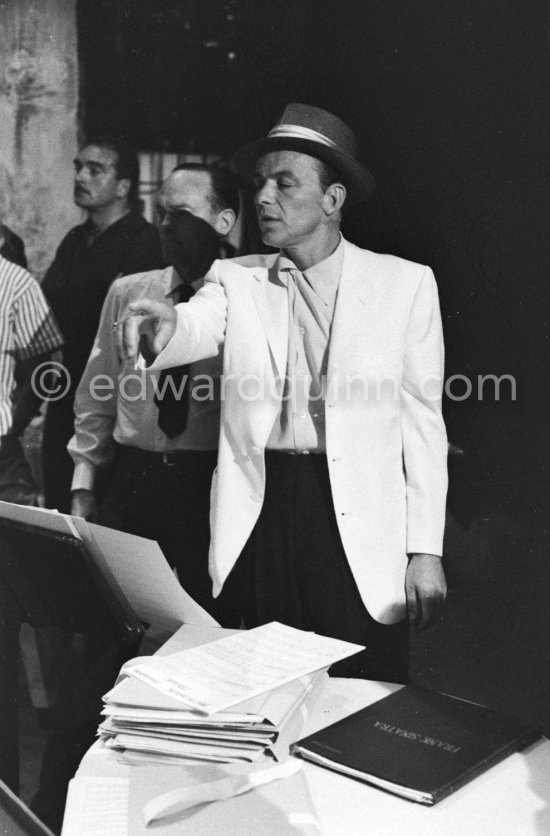 Frank Sinatra rehearsing with the orchestra at the Sporting d’Eté. Princess Grace, who was president of the Monégasque Red Cross, persuaded Sinatra to come back to Europe to sing at a gala in aid of refugee children. Monte Carlo 1958. - Photo by Edward Quinn