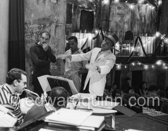 Frank Sinatra rehearsing with the orchestra at the Sporting d’Eté. Princess Grace, who was president of the Monégasque Red Cross, persuaded Sinatra to come back to Europe to sing at a gala in aid of refugee children. Monte Carlo 1958. - Photo by Edward Quinn