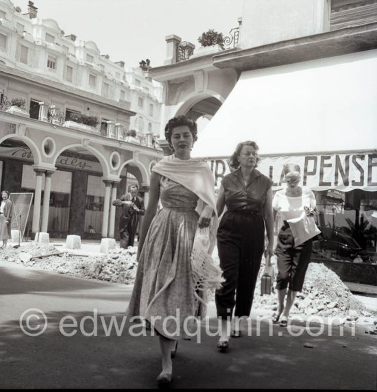 Soraya, Queen Consort and second wife of the Shah of Persia, with her mother and the secretary (from left). Cannes 1953. - Photo by Edward Quinn