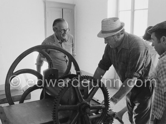 Graham Sutherland and a not yet identified person. installing a printing press at La Villa Blanche. Menton 1974. - Photo by Edward Quinn
