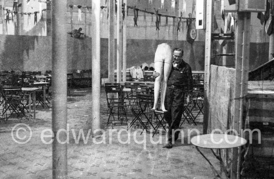 Graham Sutherland with a mannequin of the former department store where he works on curtains for Coventry Cathedral. Menton, date unknown - Photo by Edward Quinn