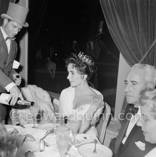 Elizabeth Taylor after the screening of "Around the World in 80 Days" at the Cannes Film Festival in 1957. She was among more than a thousand guests invited by her husband Mike Todd to a gala supper at Les Ambassadeurs to celebrate the film. At this time she was widely considered to be one of the most beautiful women in the world. - Photo by Edward Quinn