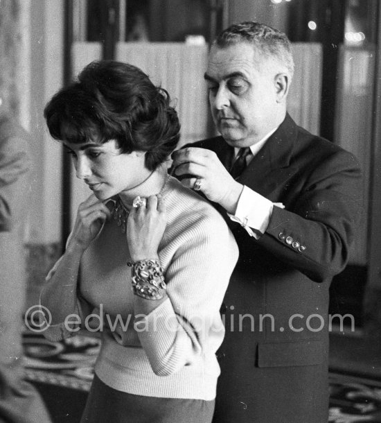 Attended by Cartier jewellers Liz Taylor tries on a beautiful diamond necklace with matching earrings she spotted while window-shopping in Monte Carlo with her third husband Mike Todd. At $500,000, the necklace was beyond Todd’s budget, but the earrings were her consolation prize. Monte Carlo 1958. - Photo by Edward Quinn