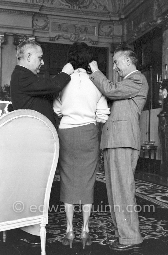 Attended by Cartier jewellers Liz Taylor tries on a beautiful diamond necklace with matching earrings she spotted while window-shopping in Monte Carlo with her third husband Mike Todd. At $500,000, the necklace was beyond Todd’s budget, but the earrings were her consolation prize. Monte Carlo 1958. - Photo by Edward Quinn