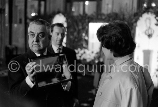 Attended by Cartier jewellers Liz Taylor tries on a beautiful diamond necklace with matching earrings she spotted while window-shopping in Monte Carlo with her third husband Mike Todd. At $500,000, the necklace was beyond Todd’s budget, but the earrings were her consolation prize. Monte Carlo 1958. - Photo by Edward Quinn