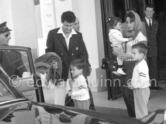 Liz Taylor outside the Carlton Hotel, Cannes, with Eddie Fisher, her two sons from her second marriage with Michael Wilding, Michael and Christopher Wilding, and Liza Todd, her daughter from her third marriage to Mike Todd, Cannes 1959. - Photo by Edward Quinn