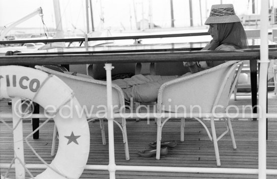 Liz Taylor on board the yacht Olnico, which she and her new husband Eddie Fisher had chartered for their honeymoon cruise of the Mediterranean and berthed in the harbor at Cannes, 1959. - Photo by Edward Quinn