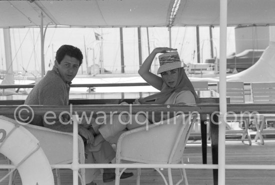 Liz Taylor and her new husband Eddie Fisher on board the yacht Olnico, which they had chartered for their honeymoon cruise of the Mediterranean and berthed in the harbor at Cannes, 1959. - Photo by Edward Quinn