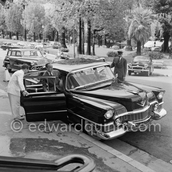 Totò, Italian comedian. Departure from Hotel de Paris. Monte Carlo 1954. Cars: 1954 Cadillac Series 60 Special Fleetwood. In the background 1954 De Soto Firedome station wagon; 1954 Simca Aronde - Photo by Edward Quinn