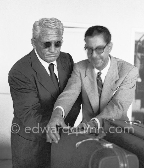 Spencer Tracy at the customs office at Nice Airport, helped by a Nice official. Tracy had come to Cannes in 1953. to discuss a film based on Hemingway’s novel "The Old Man and the Sea." Nice 1953. - Photo by Edward Quinn