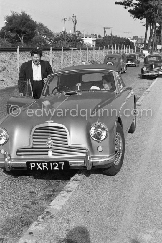 Peter Ustinov near the Studios de la Victorine during filming of "Lola Montès". Nice 1955. Car: 1955 Aston Martin DB 2/4 Drophead coupé - Photo by Edward Quinn