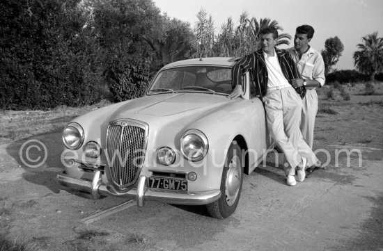 Two cool looking actors and their car: Henri Vidal and Philippe Nicaud. Studios de la Victorine, during filming of "Voulez-vous danser avec moi?" ("Come Dance With Me"). Nice 1959. Car: 1958 Lancia Aurelia B20 Gran Turismo 2500 - Photo by Edward Quinn