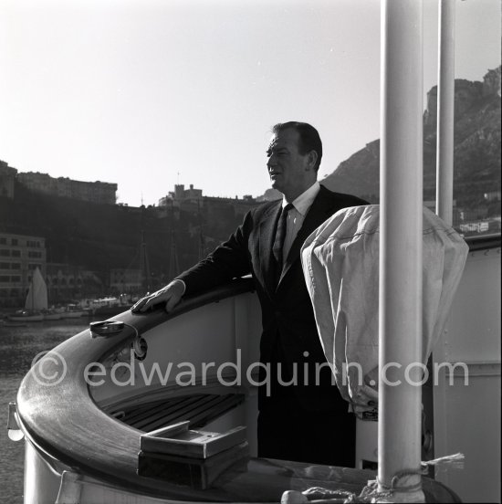 John Wayne on board Onassis' yacht Christina. Monaco harbor 1955. - Photo by Edward Quinn