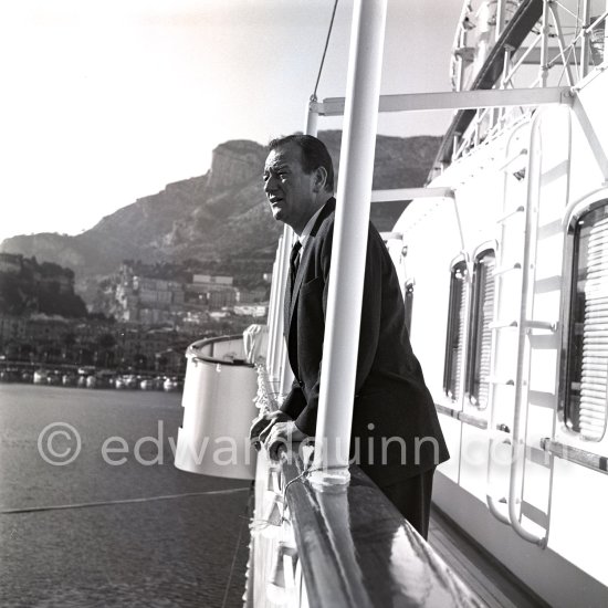 John Wayne on board Onassis\' yacht Christina. Monaco harbor 1955. - Photo by Edward Quinn