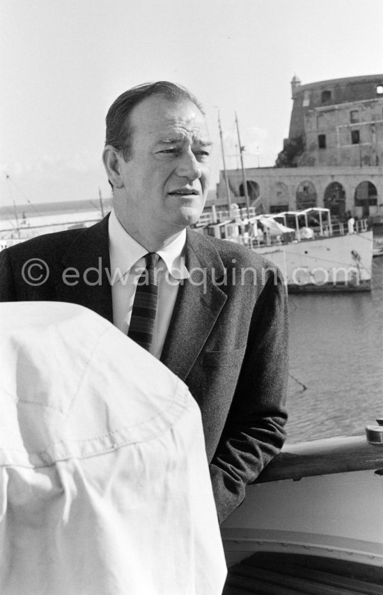 John Wayne on board Onassis\' yacht Christina. Monaco harbor 1955. - Photo by Edward Quinn