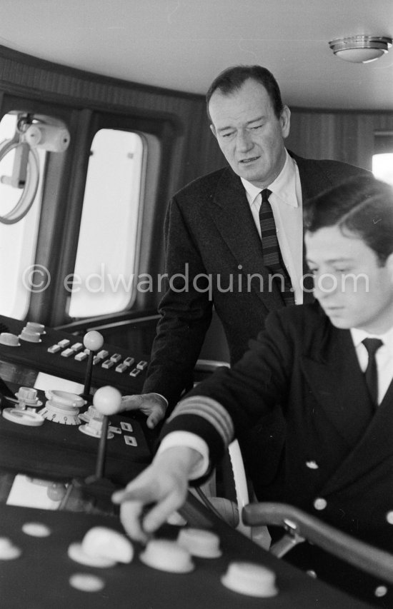 John Wayne on board Onassis' yacht Christina. Monaco harbor 1955. - Photo by Edward Quinn